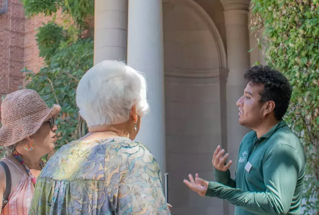 A guide discusses the history and horticulture of Filoli with guests.